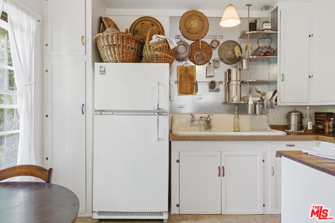 1019 Pine Street Santa Monica, CA 90405 - Photo 25 of 36 a kitchen with cabinets a sink and a stove