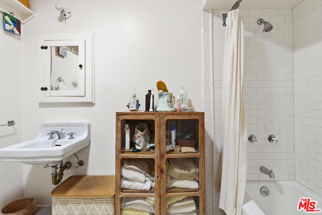 1019 Pine Street Santa Monica, CA 90405 - Photo 29 of 36 a bathroom with a sink and a mirror
