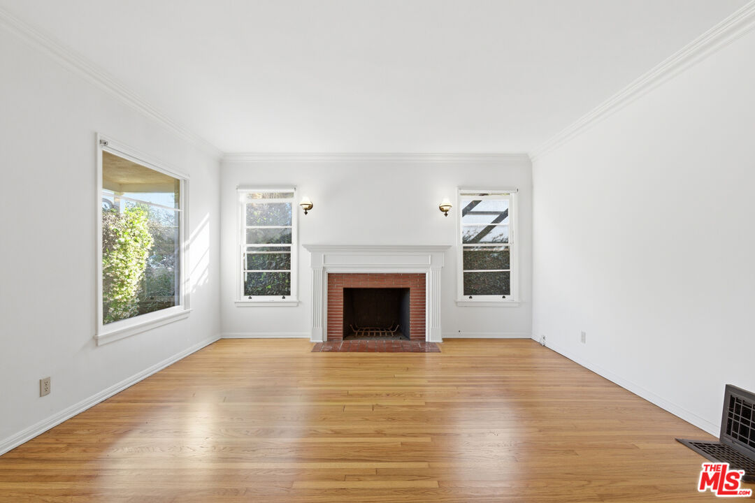 1019 Pine Street Santa Monica, CA 90405 - Photo 3 of 36 a view of an empty room with wooden floor and a window