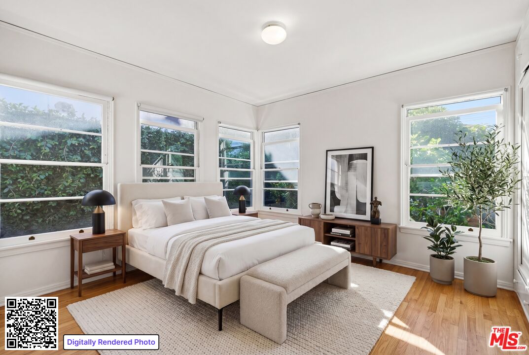 1019 Pine Street Santa Monica, CA 90405 - Photo 7 of 36 a bedroom with a large bed and windows