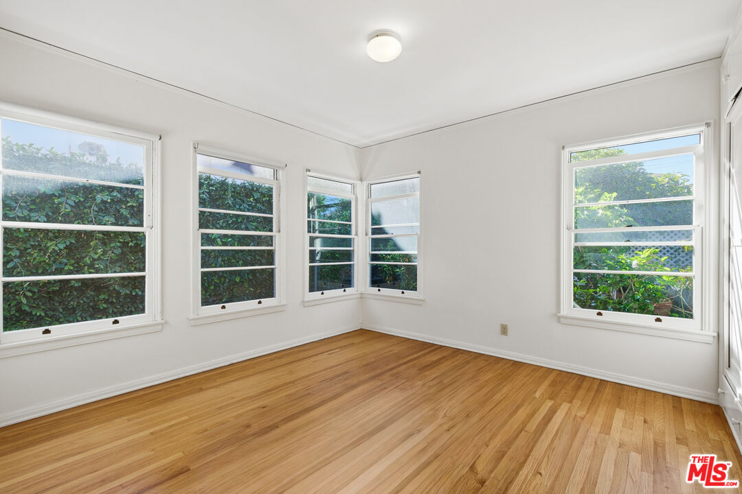 1019 Pine Street Santa Monica, CA 90405 - Photo 8 of 36 a view of an empty room with wooden floor and windows