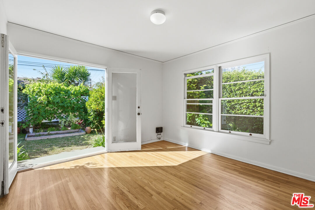 1019 Pine Street Santa Monica, CA 90405 - Photo 10 of 36 a view of an empty room with wooden floor and a window