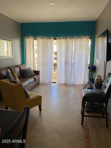 a bedroom with bed and a window