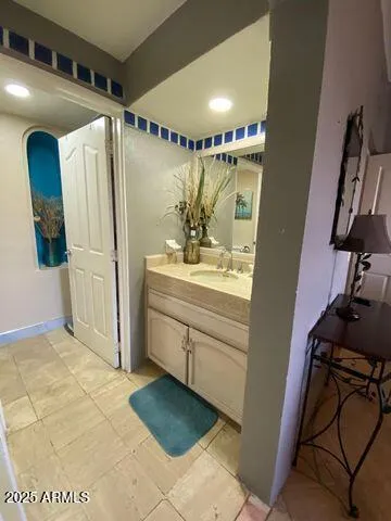 a bathroom with a sink and a mirror