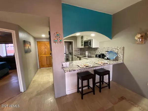 a dinning table and chairs in a room