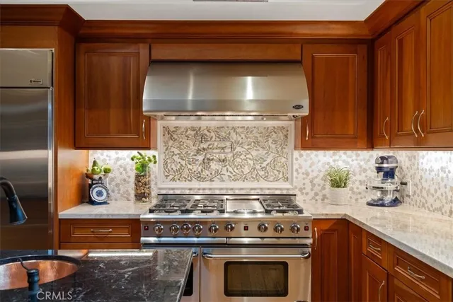 a view of a patio with a table and chairs