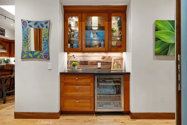 a view of a livingroom with furniture and hardwood floor