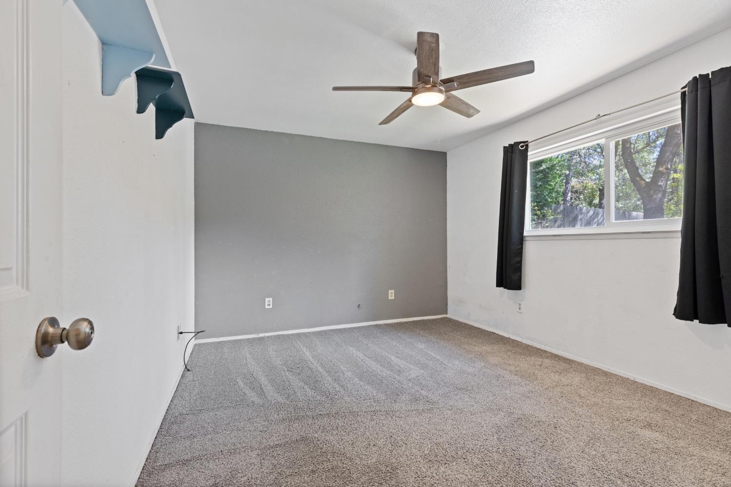 2971 Letitia Avenue Placerville, CA 95667 - Photo 53 of 65 an empty room with windows and fan