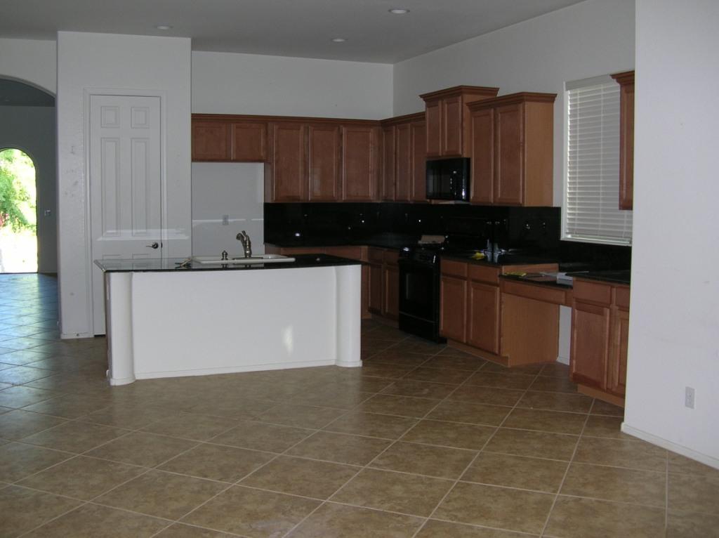 4584 North Point Ridge Road Buckeye, AZ 85396 - Photo 3 of 10 Family room view to Kitchen