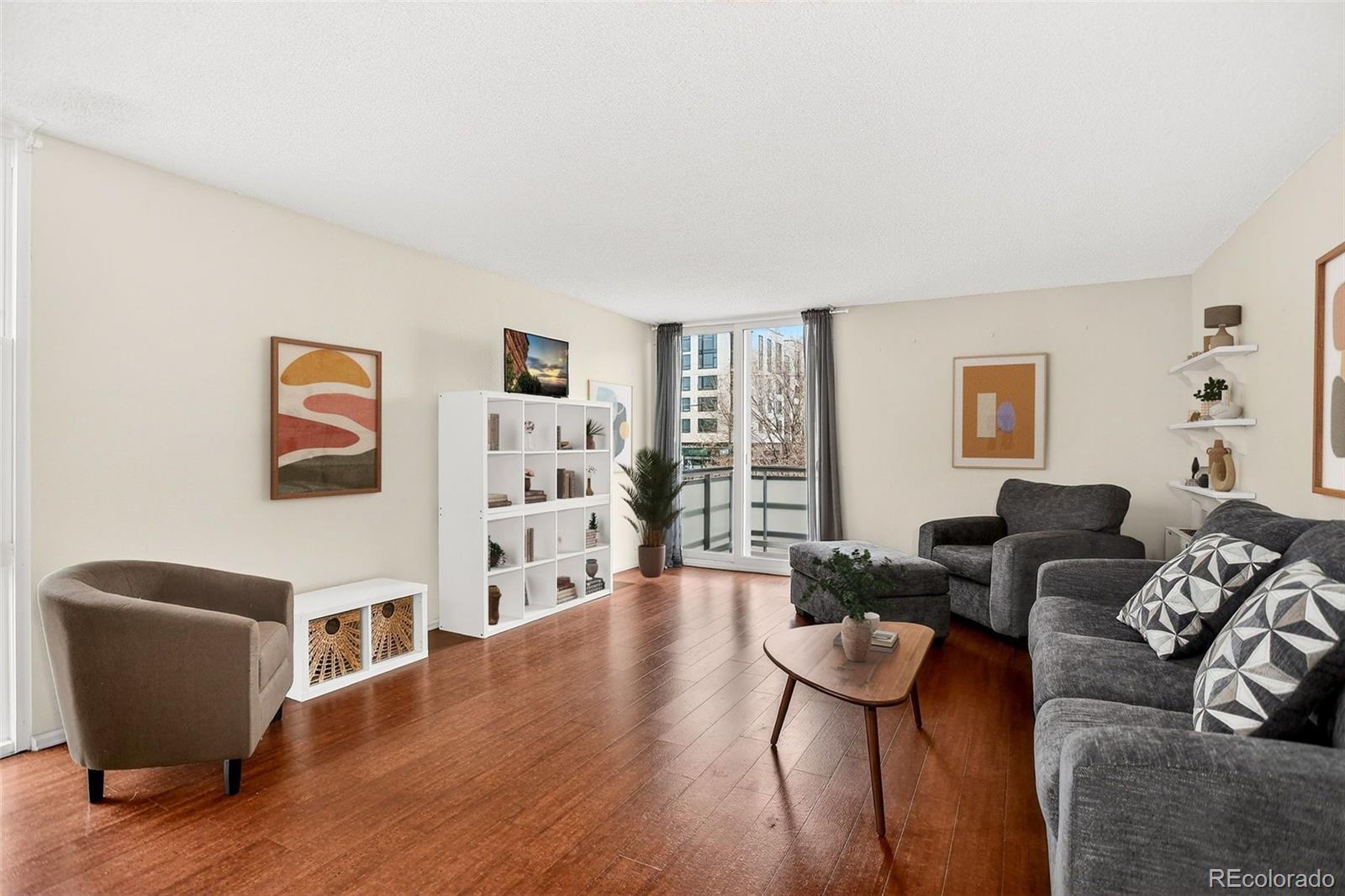 2500 South York Street, Unit 401 Denver, CO 80210 - Photo 2 of 30 a living room with furniture and a wooden floor