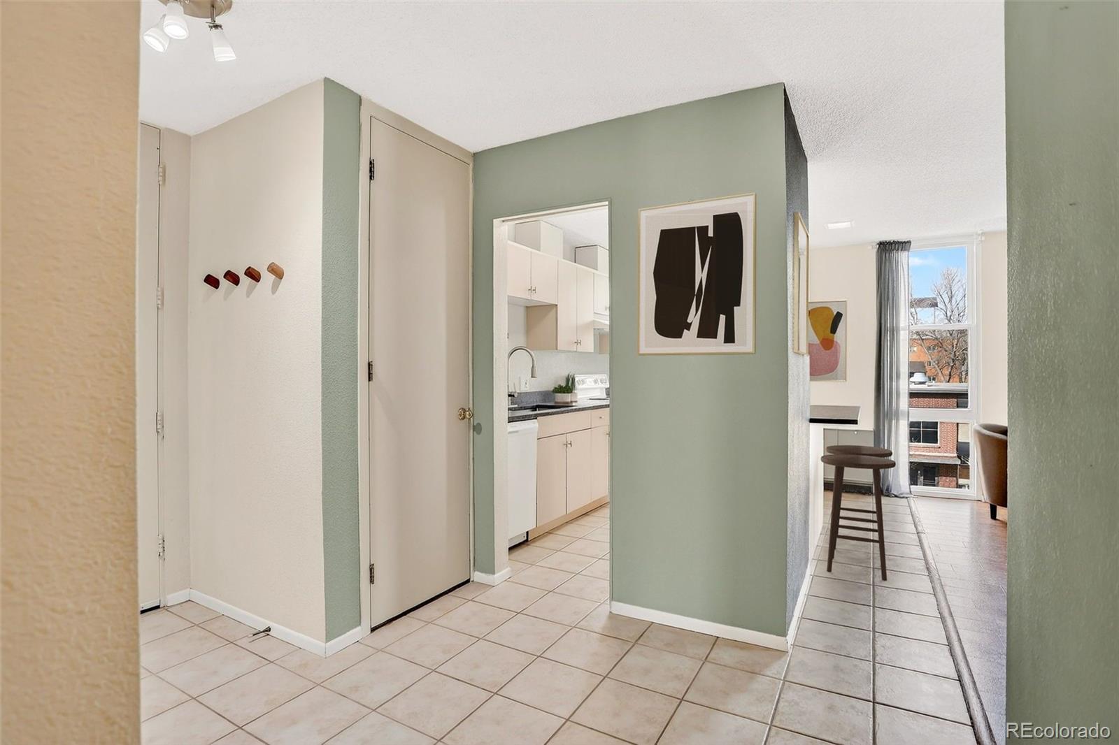 2500 South York Street, Unit 401 Denver, CO 80210 - Photo 4 of 30 a view of a kitchen from the hallway