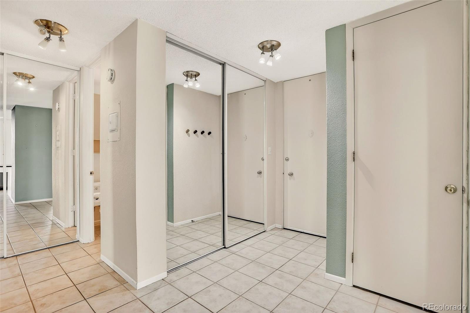 2500 South York Street, Unit 401 Denver, CO 80210 - Photo 5 of 30 a view of a bathroom with a shower and a sink
