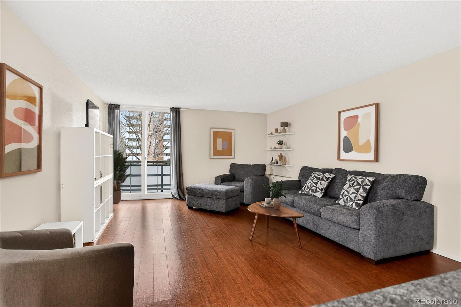 2500 South York Street, Unit 401 Denver, CO 80210 - Photo 7 of 30 a living room with furniture and a wooden floor