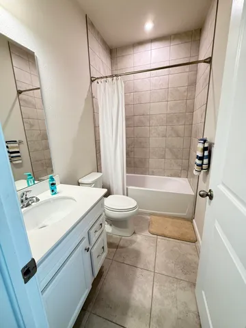 a bathroom with a sink a toilet and a bathtub