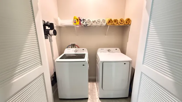 a utility room with dryer and washer