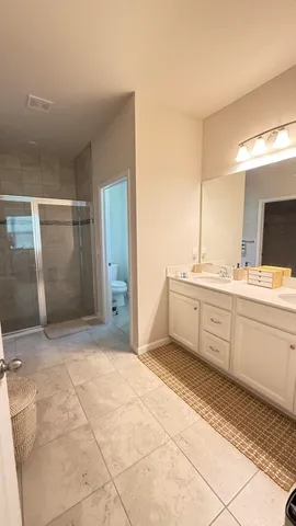 a bathroom with a sink a mirror and a bathtub