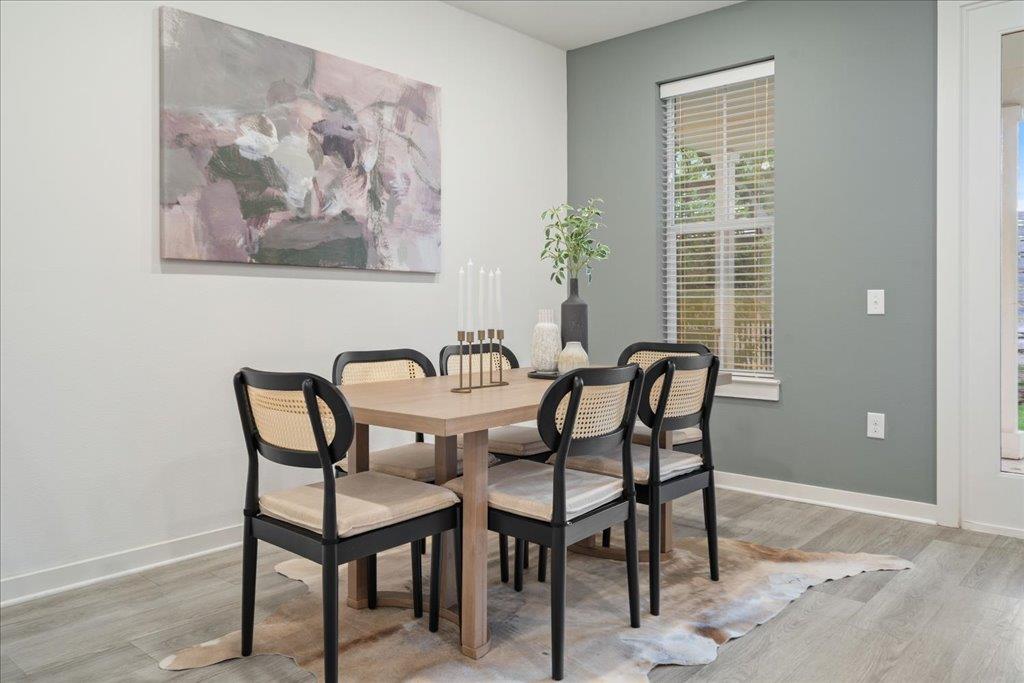2624 Metcalfe Road, Unit 10 Austin, TX 78741 - Photo 10 of 27 Dining space with light wood finished floors and baseboards
