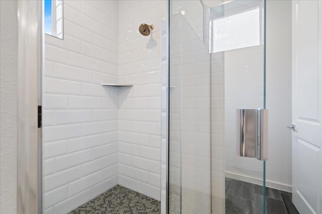 2624 Metcalfe Road, Unit 10 Austin, TX 78741 - Photo 16 of 27 Full bath featuring a stall shower