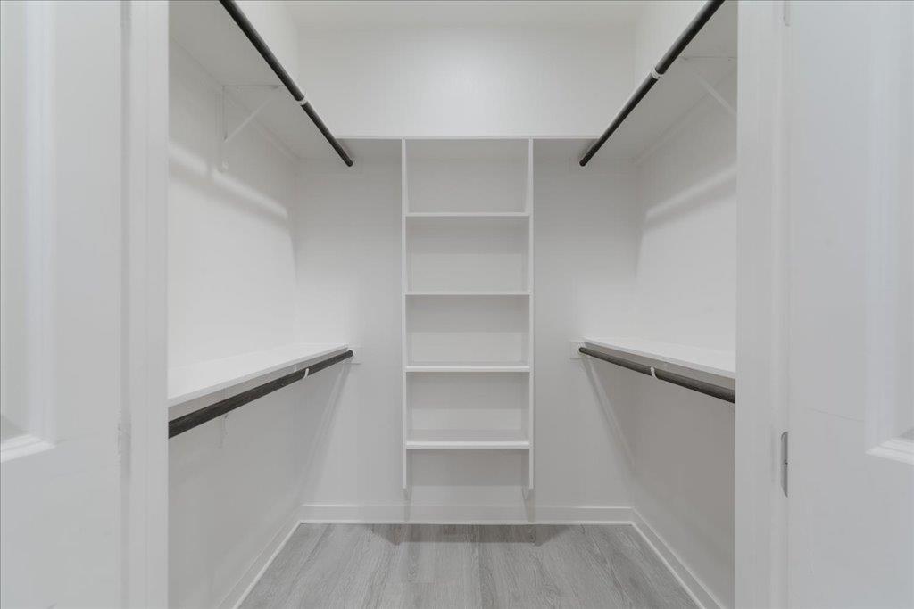 2624 Metcalfe Road, Unit 10 Austin, TX 78741 - Photo 17 of 27 Spacious closet with light wood finished floors
