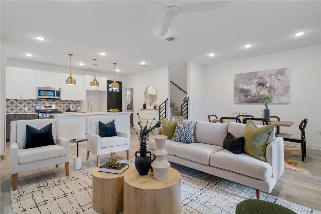 2624 Metcalfe Road, Unit 10 Austin, TX 78741 - Photo 2 of 27 Living room with light wood-type flooring, recessed lighting, and stairway