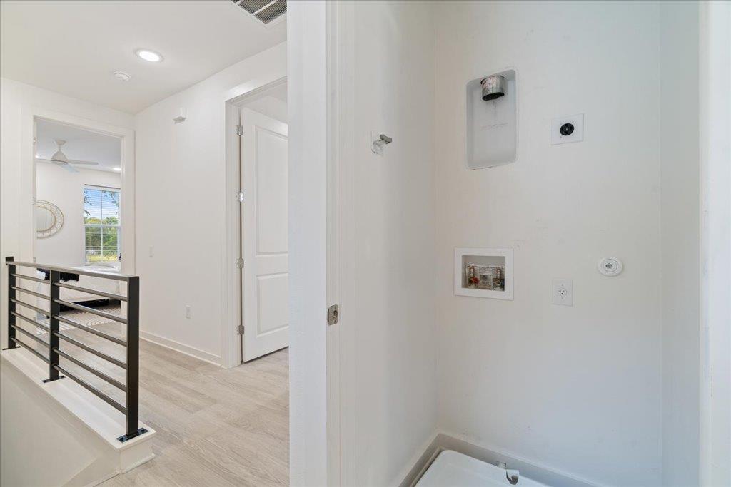 2624 Metcalfe Road, Unit 10 Austin, TX 78741 - Photo 21 of 27 Laundry room featuring hookup for a washing machine, light wood-style flooring, and recessed lighting