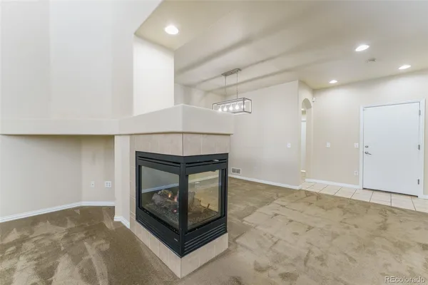 a living room with a fireplace