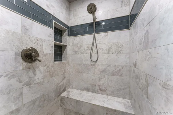 a bathroom with a shower and a shower