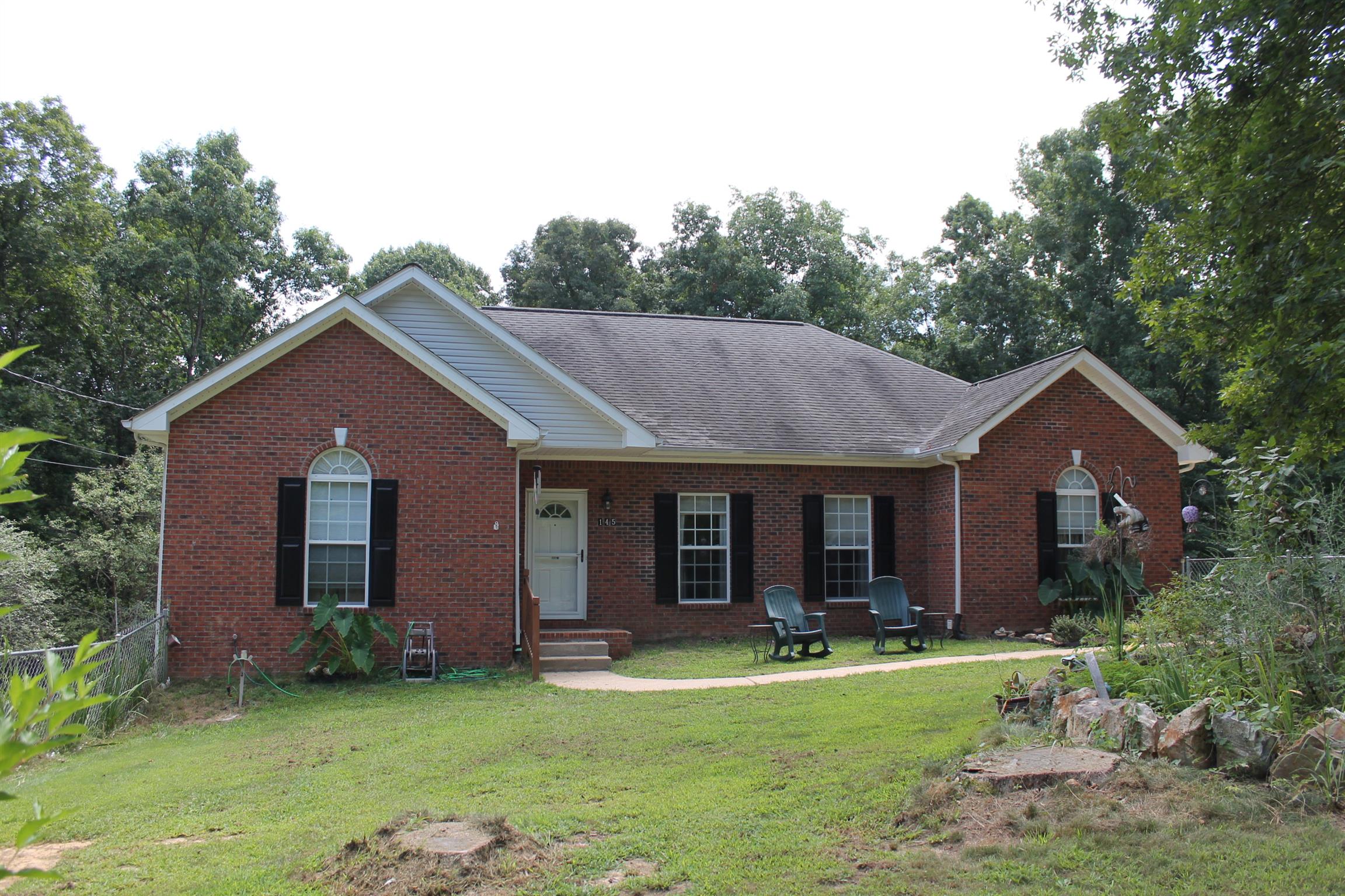 145 Overlook Road Dover, TN 37058 - Photo 1 of 26 145 Overlook Rd with new storm door and fenced front yard for safety