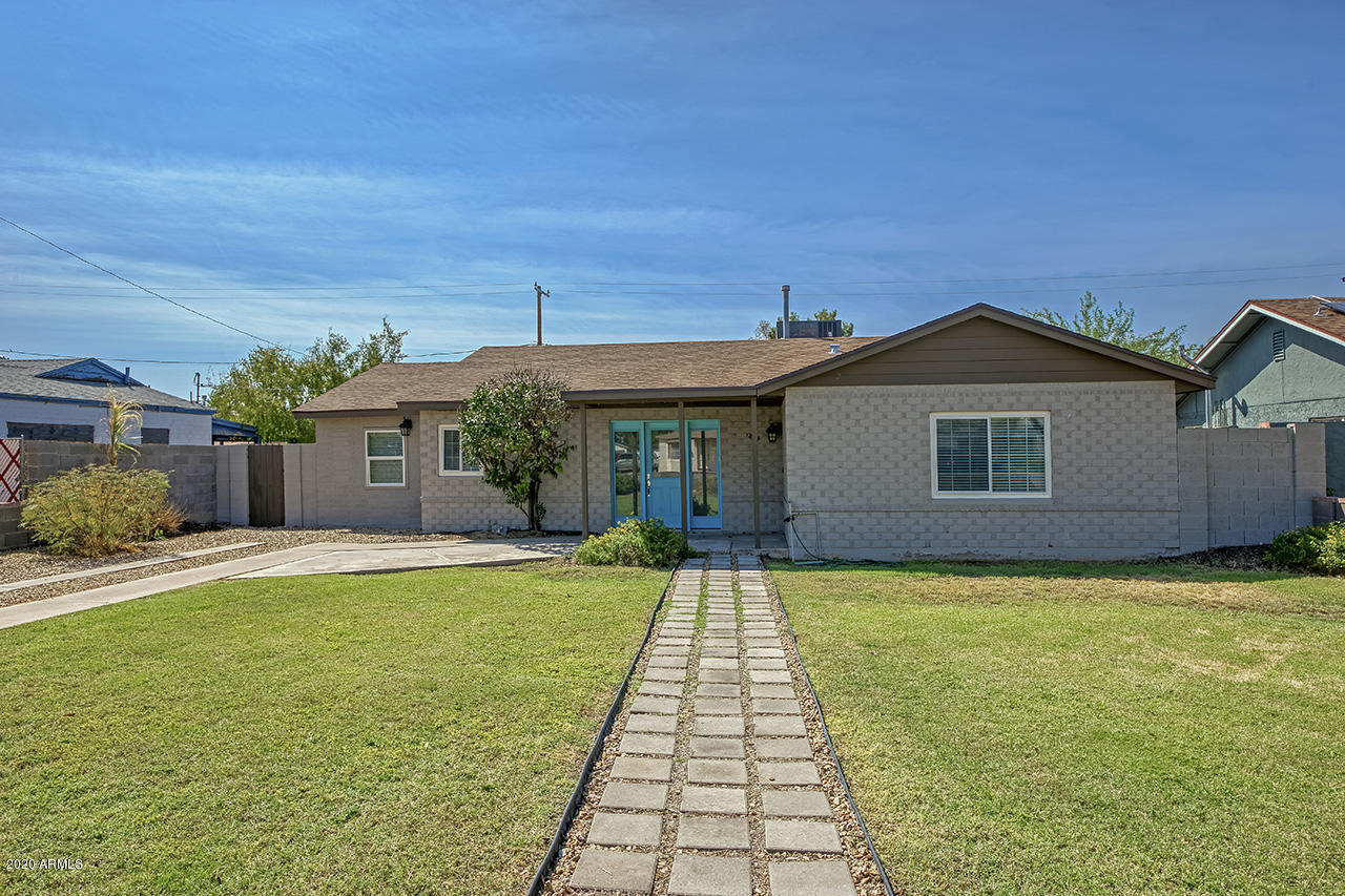 1423 East Granada Road Phoenix, AZ 85006 - Photo 1 of 25 a front view of a house with a yard