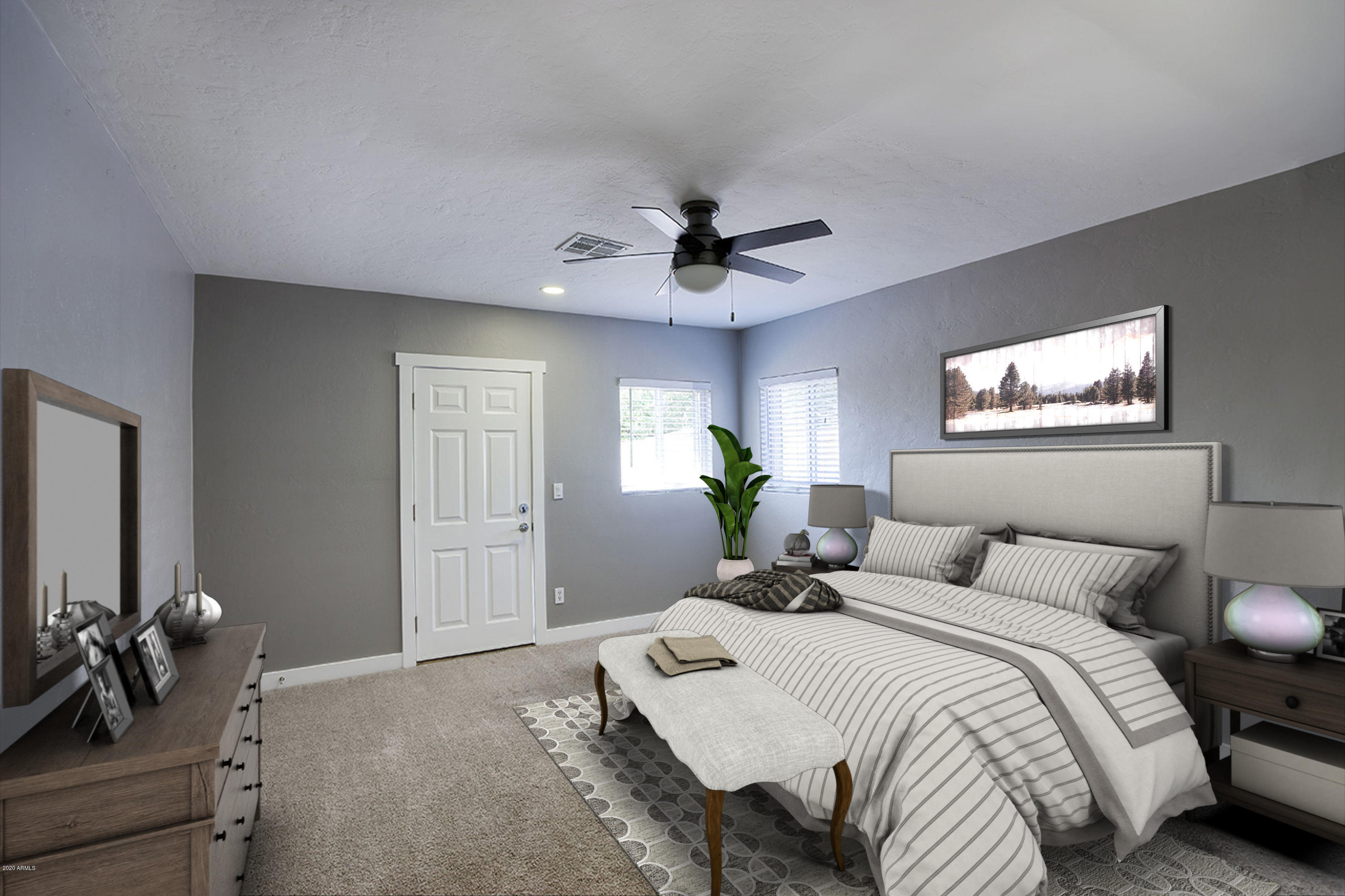 1423 East Granada Road Phoenix, AZ 85006 - Photo 10 of 25 a bedroom with bed and a chandelier