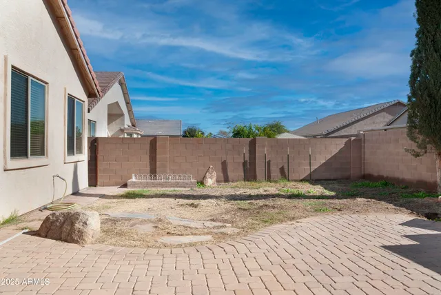 a bedroom with a bed and a white house