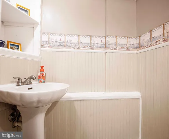 a view of a patio with a table and chairs under an umbrella