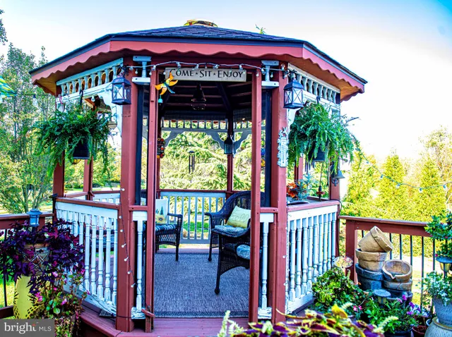 a view of a swimming pool with an outdoor seating and yard