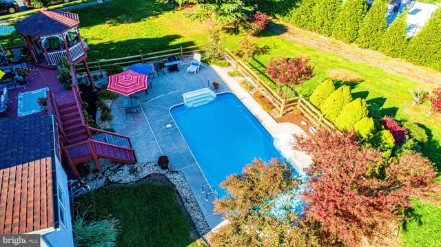 a front view of house with yard and outdoor seating