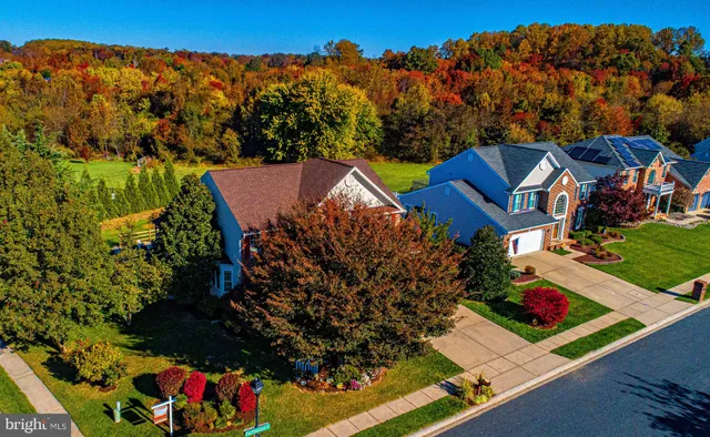 a aerial view of a house with a yard and garden