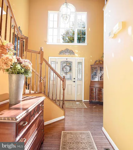 a view of a balcony with wooden floor and furniture