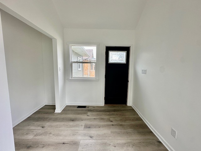 527 12th Street Peru, IL 61354 - Photo 2 of 15 an empty room with wooden floor and windows
