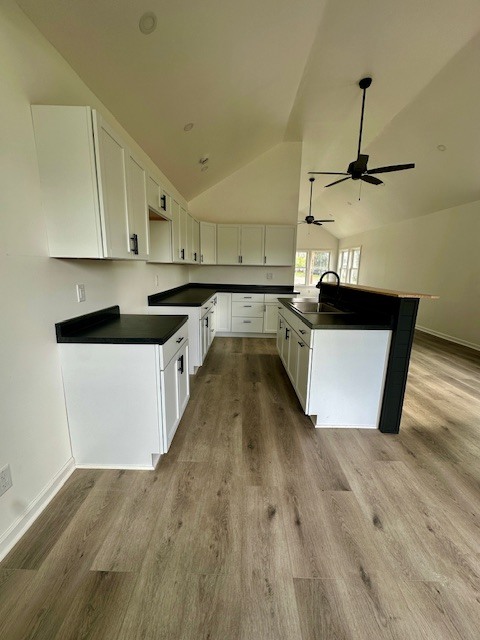 527 12th Street Peru, IL 61354 - Photo 5 of 15 a kitchen with stainless steel appliances a sink a stove top oven a counter space and cabinets