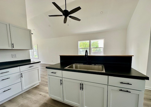 527 12th Street Peru, IL 61354 - Photo 7 of 15 a kitchen with a sink and white cabinets