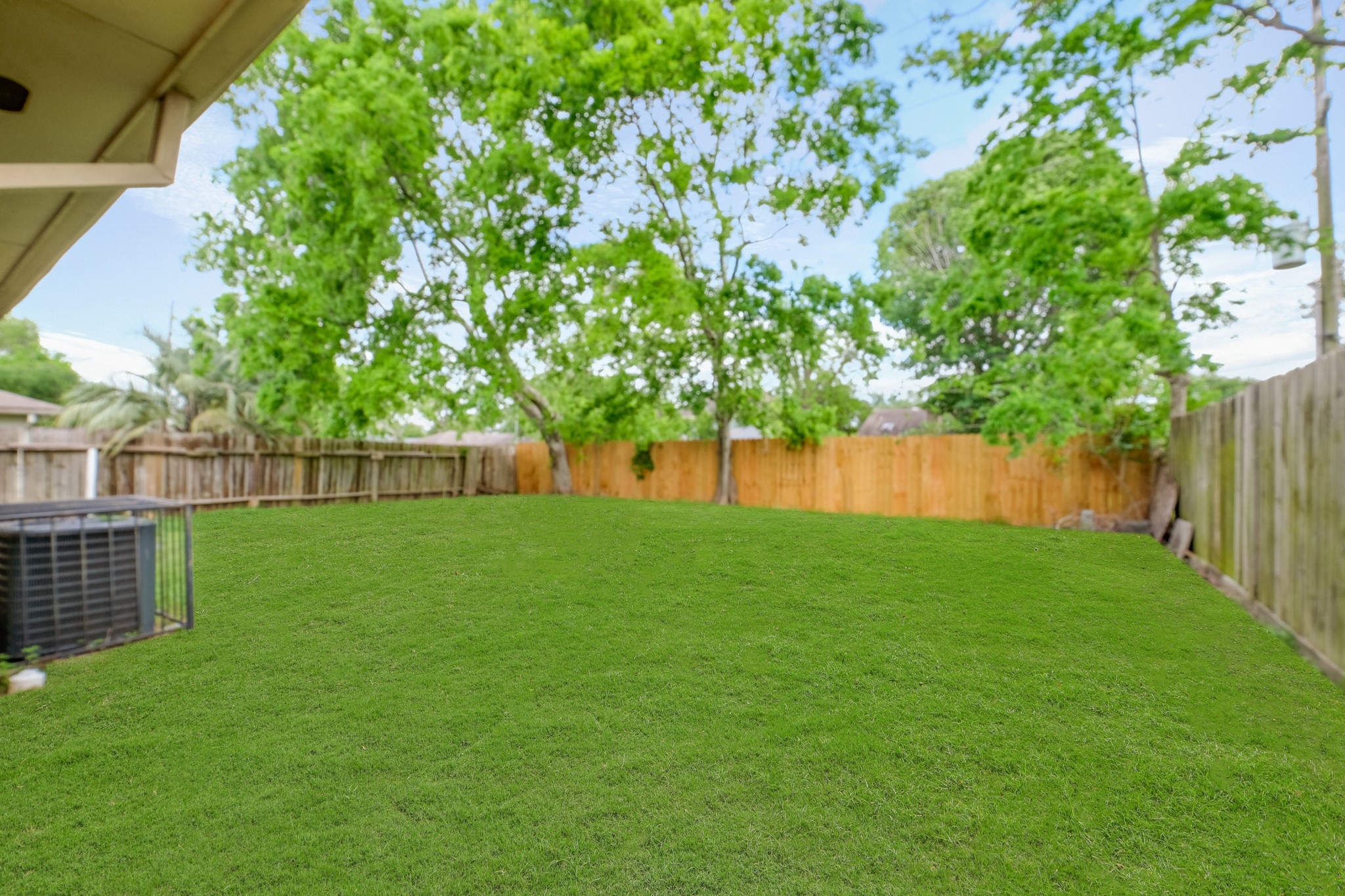 6607 Navidad Road Houston, TX 77083 - Photo 11 of 11 a view of yard with grass and trees