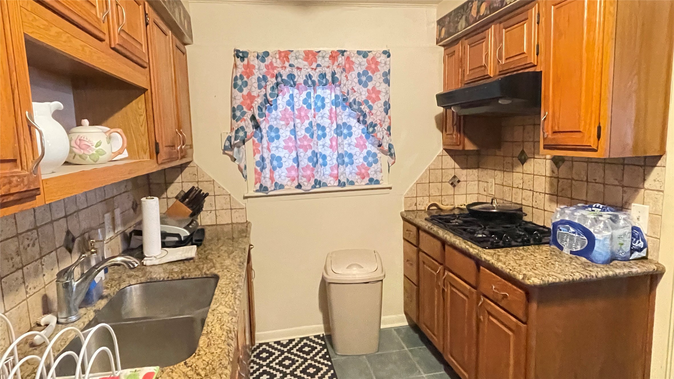 17 Manor Way Galveston, TX 77550 - Photo 14 of 23 a kitchen with a stove and a sink