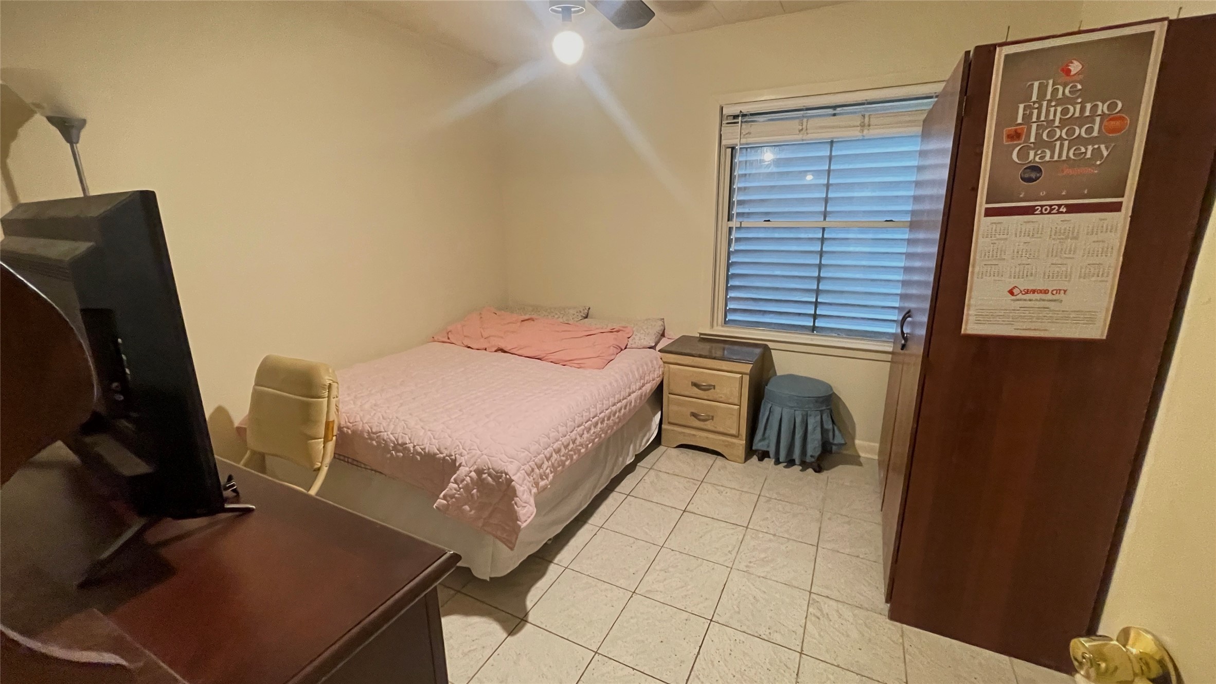 17 Manor Way Galveston, TX 77550 - Photo 19 of 23 a bedroom with a bed and wooden floor