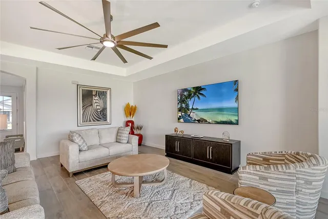 a kitchen with kitchen island white cabinets and stainless steel appliances