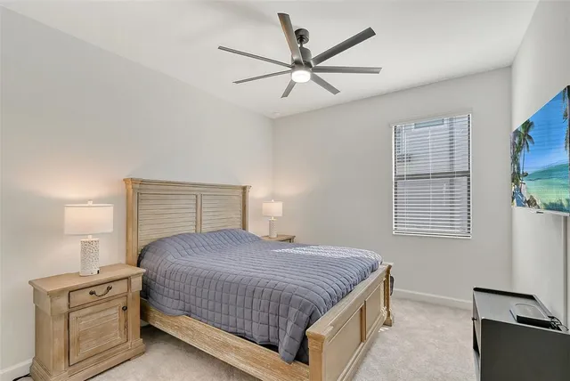 a view of a dining room with furniture and a floor to ceiling window