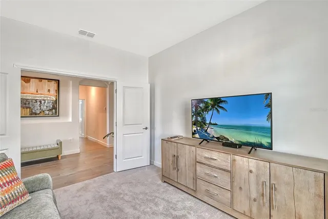 a living room with furniture and a rug