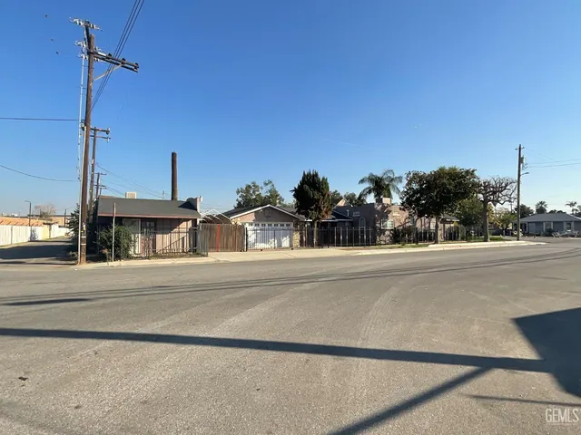 a view of a street with houses on both side of road