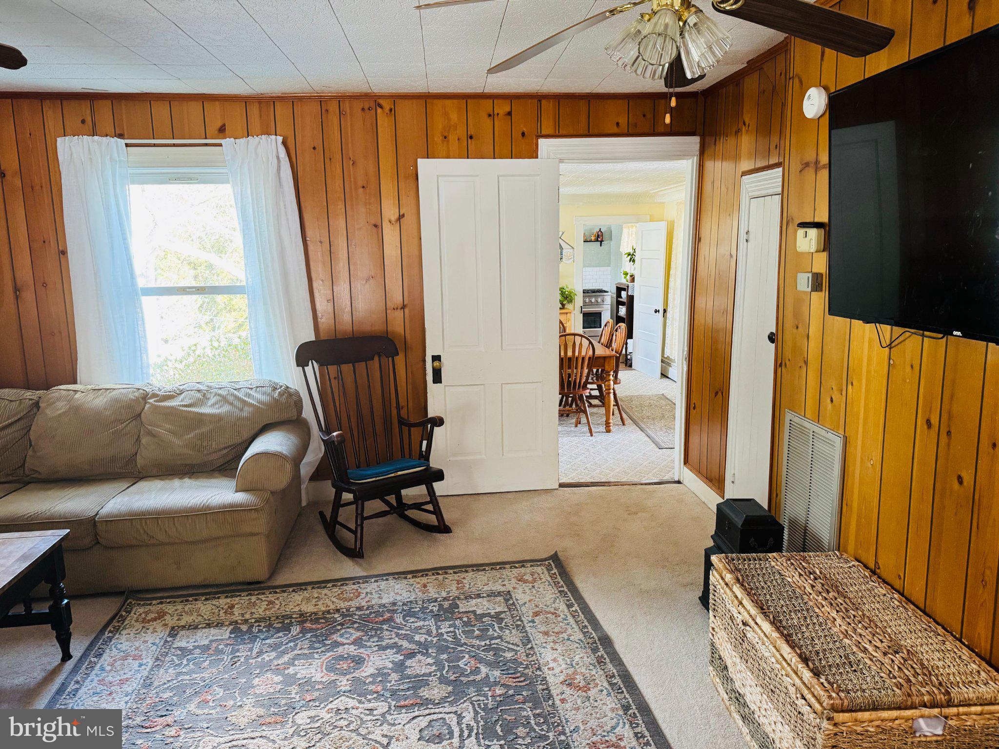 12704 Newland Road Warsaw, VA 22572 - Photo 3 of 8 Cozy living space with rustic charm.