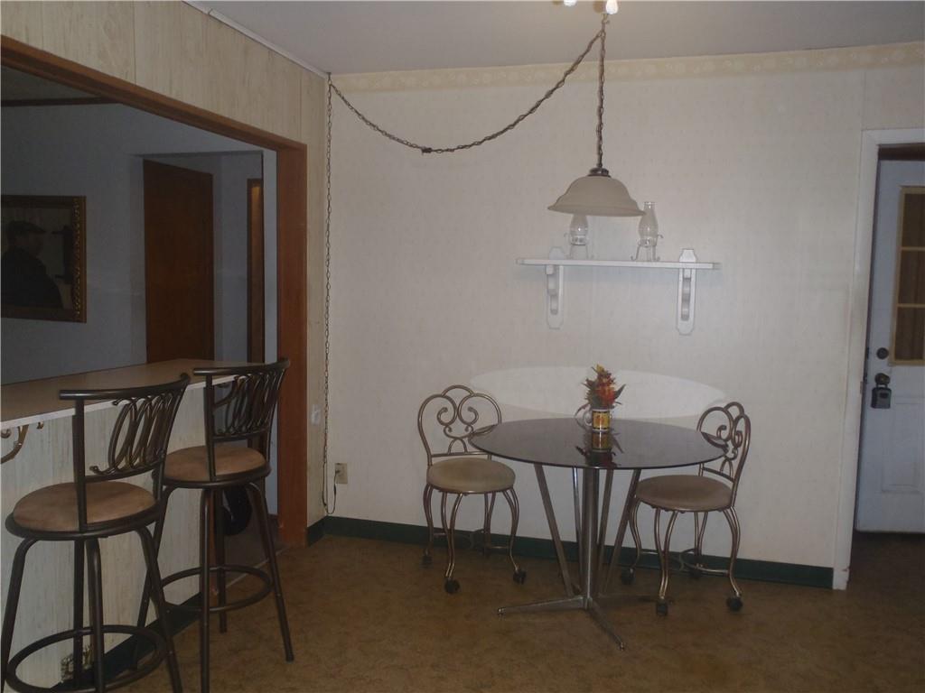 2614 Old Pittsburgh Road New Castle, PA 16101 - Photo 5 of 16 a view of a dining room with furniture and wooden floor