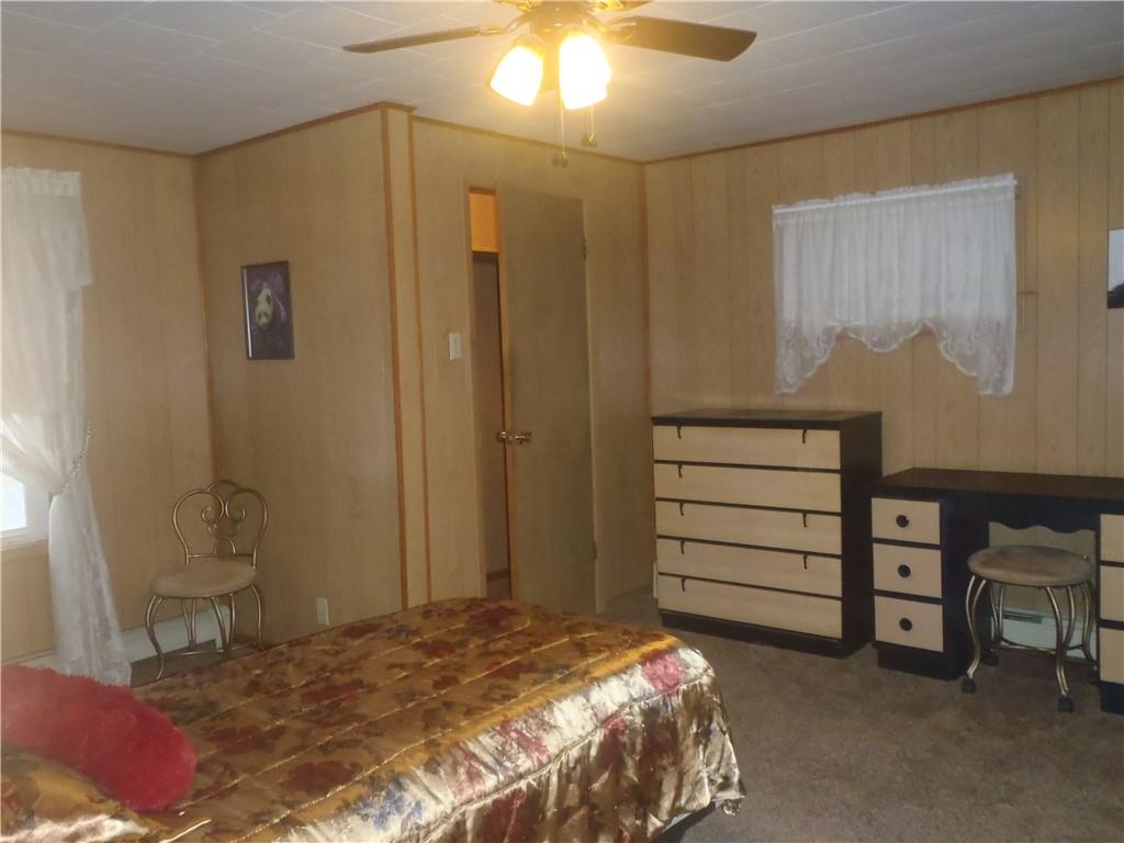 2614 Old Pittsburgh Road New Castle, PA 16101 - Photo 6 of 16 a bedroom with a bed and a cabinets