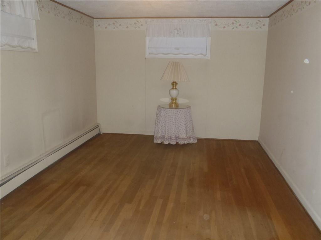 2614 Old Pittsburgh Road New Castle, PA 16101 - Photo 8 of 16 a view of storage and utility room with wooden floor
